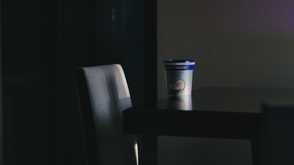 a coffee cup sitting on top of a wooden table
